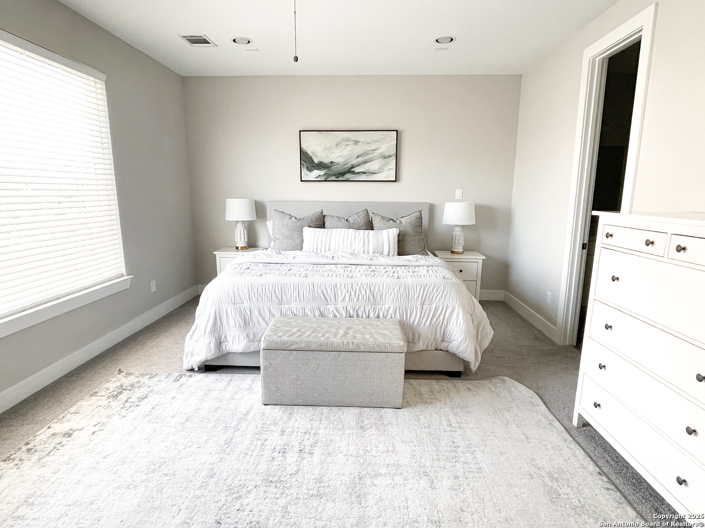 2502 Hadley Street Houston, TX 77003 - Photo 9 of 23 a bedroom with a large bed and a window