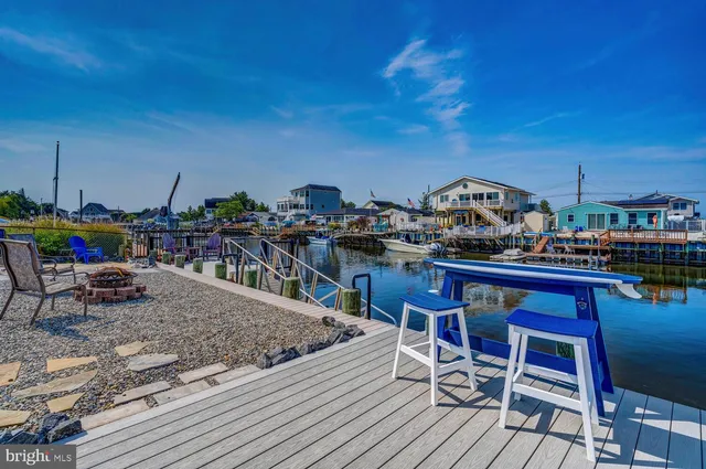 a lake view with boat and palm trees