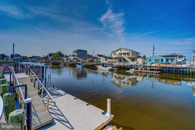 a view of a house with backyard porch and sitting area
