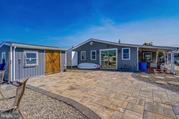 a living room with furniture a rug and a window