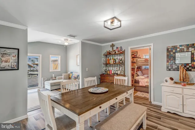 a large kitchen with a table and chairs