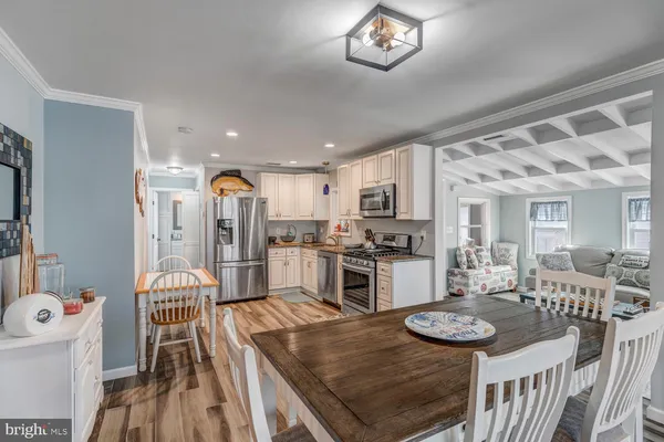 a view of a livingroom with furniture and a flat screen tv