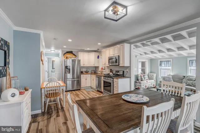 a view of a livingroom with furniture and a flat screen tv
