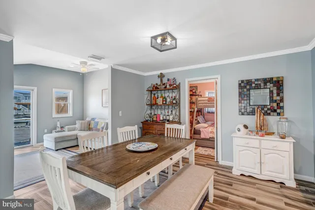 a large kitchen with a table and chairs