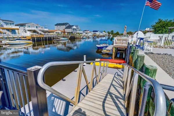 a balcony with furniture and a potted plant