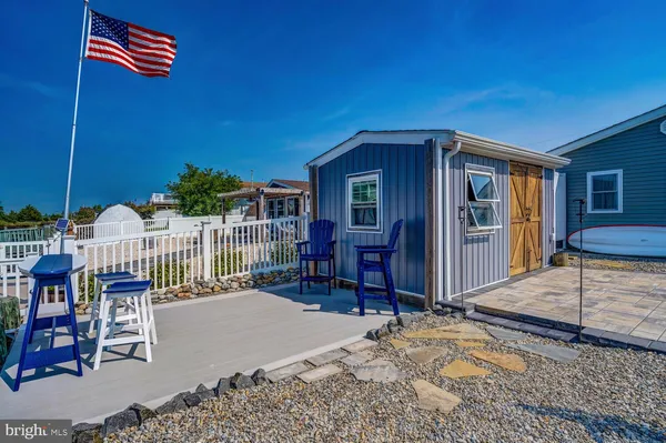 a view of a chairs and table on the terrace