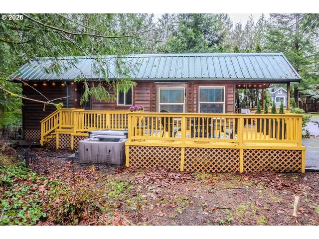 a view of a wooden deck with a yard