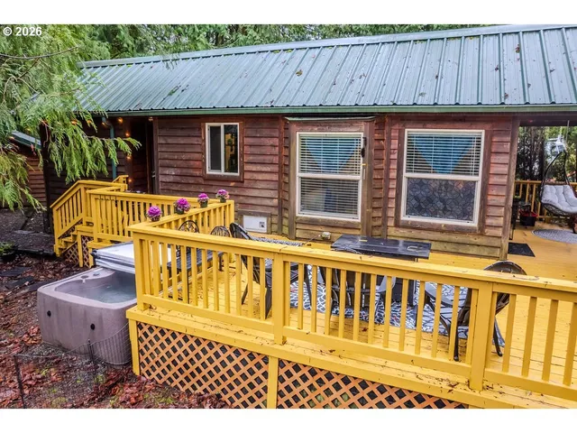 a terrace of a house with swimming pool outdoor seating