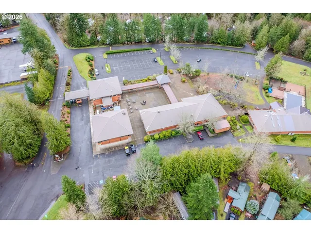 a aerial view of a house with a yard