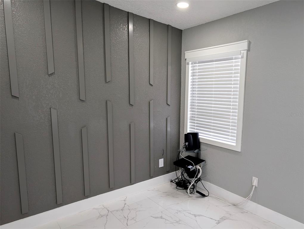 1245 North Pine Hills Road Orlando, FL 32808 - Photo 14 of 14 a room with a window