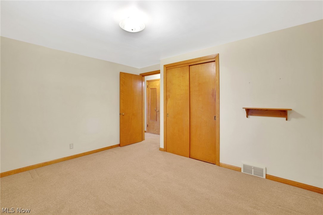 4820 15th Street Northwest Canton, OH 44708 - Photo 15 of 28 Bedroom with carpet and closet