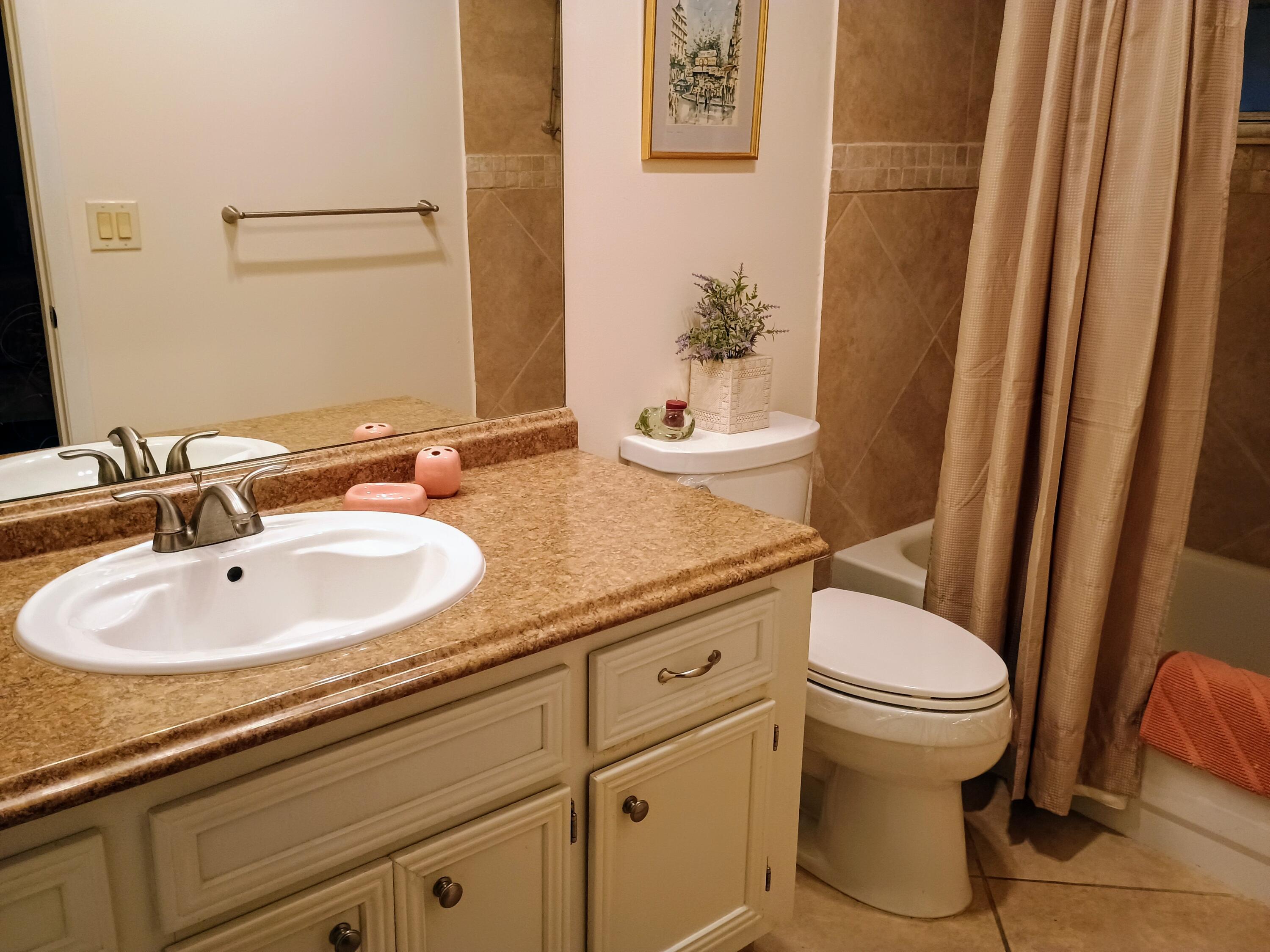 14716 Canalview Drive, Unit D Delray Beach, FL 33484 - Photo 13 of 17 a bathroom with a sink and a toilet