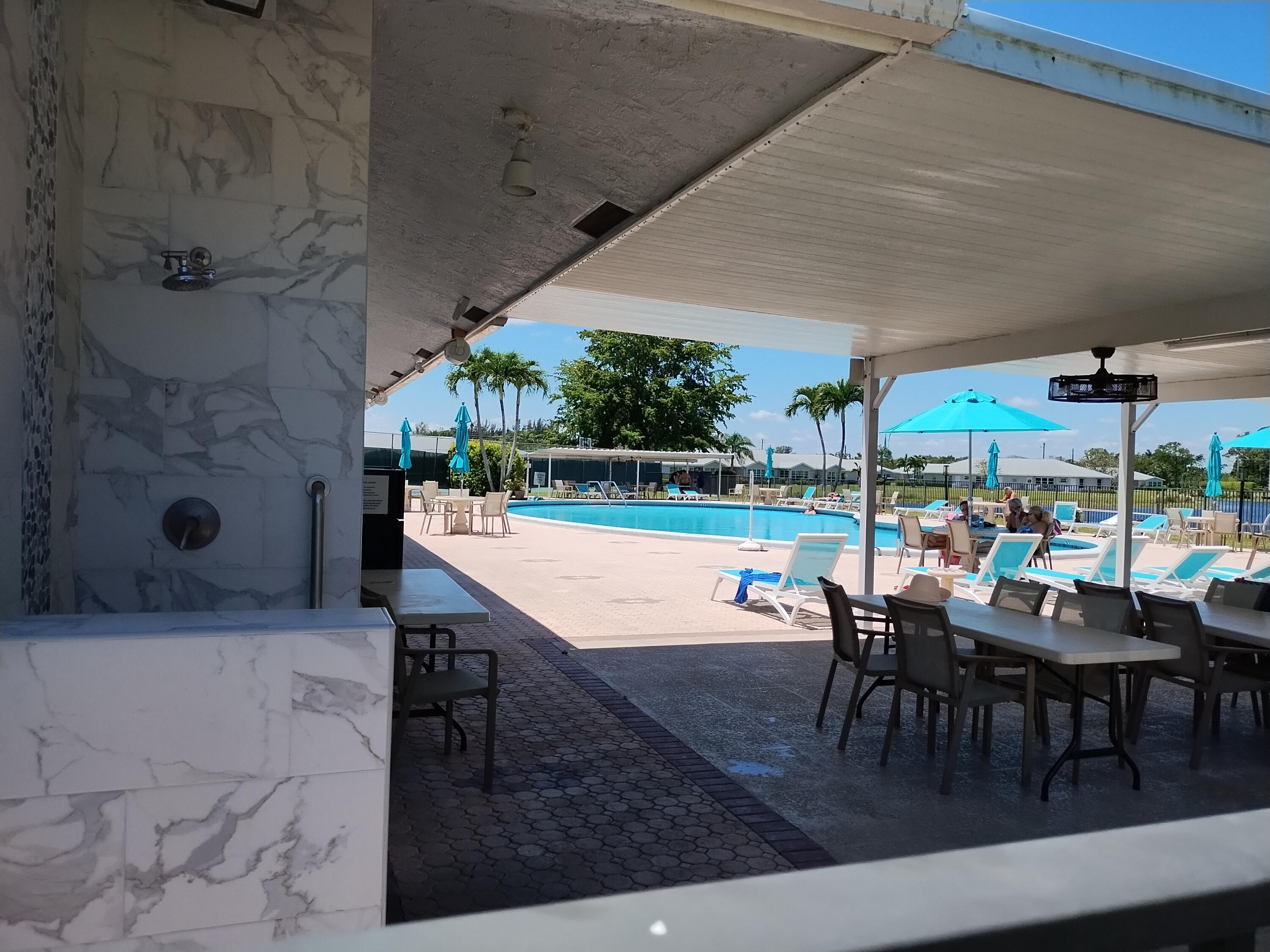 14716 Canalview Drive, Unit D Delray Beach, FL 33484 - Photo 17 of 17 an outdoor space with seating