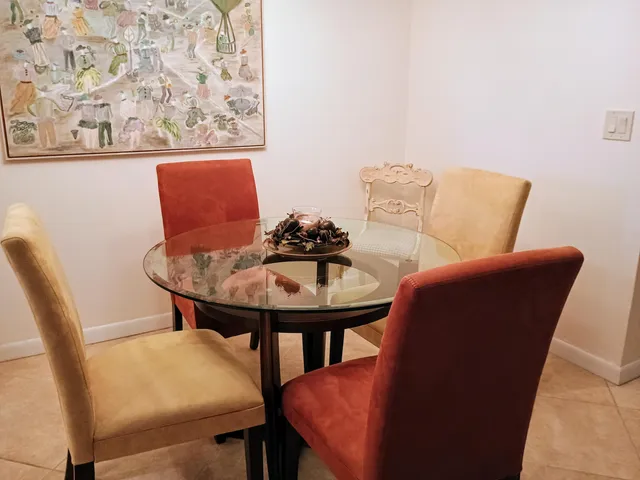 a balcony with table and chairs