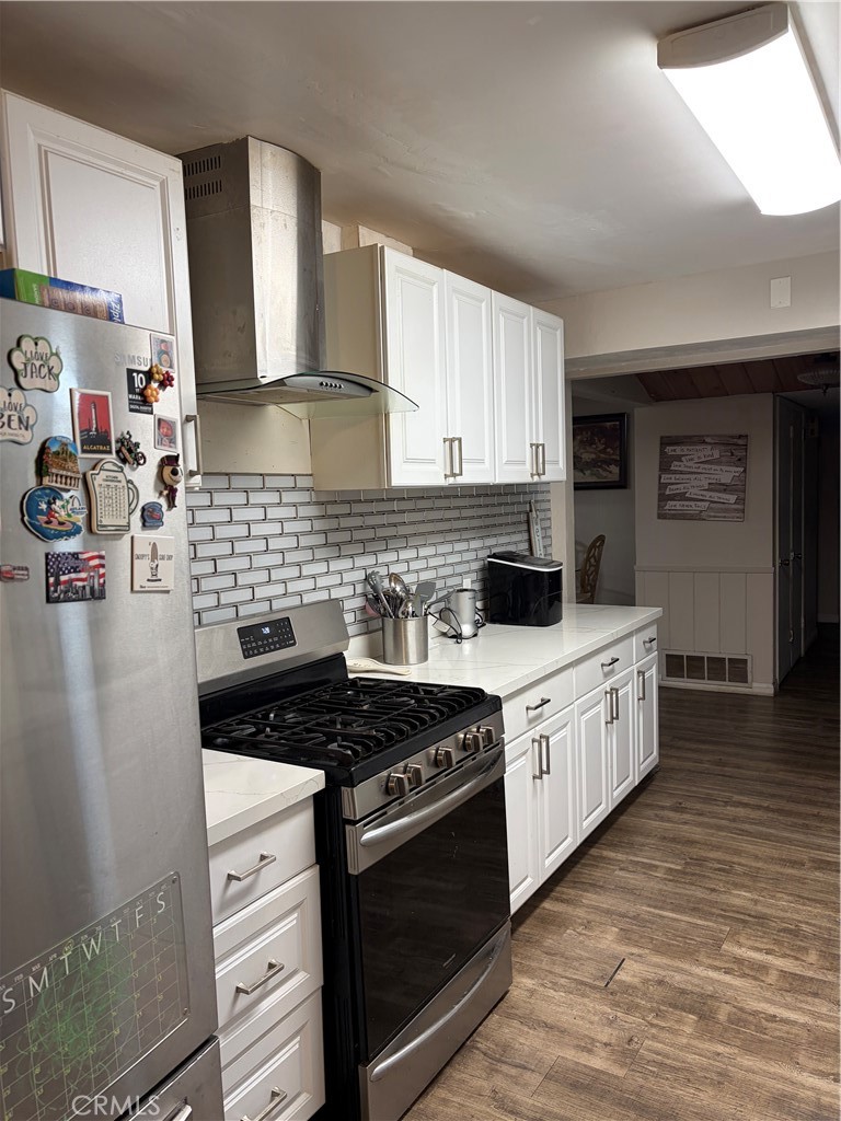 646 El Rancho Drive El Cajon, CA 92019 - Photo 8 of 23 a kitchen with stainless steel appliances a stove sink and cabinets