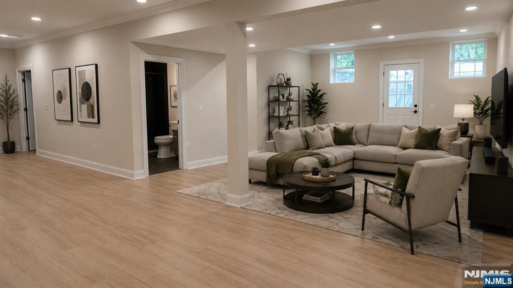 405 Valley Road River Edge, NJ 07661 - Photo 16 of 20 a living room with furniture and a chandelier