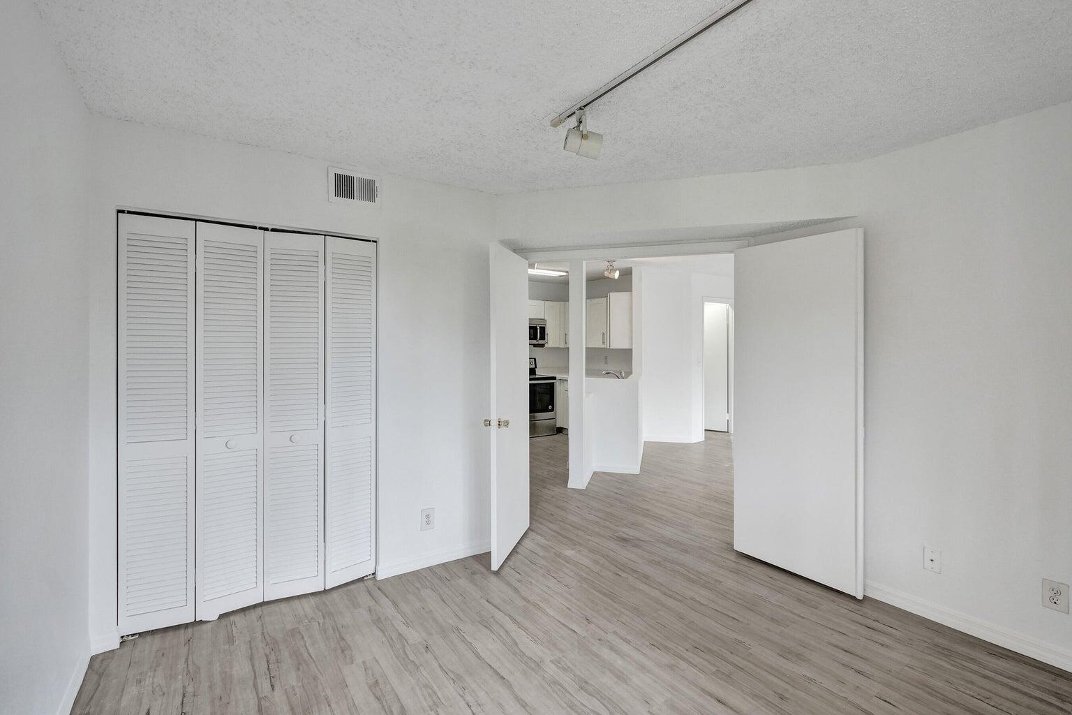 4015 West McNab Road, Unit D204 Pompano Beach, FL 33069 - Photo 20 of 46 a view of empty room with wooden floor