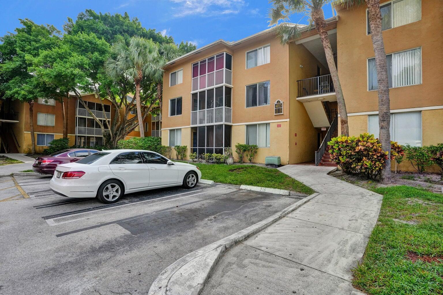4015 West McNab Road, Unit D204 Pompano Beach, FL 33069 - Photo 2 of 46 a view of street with cars