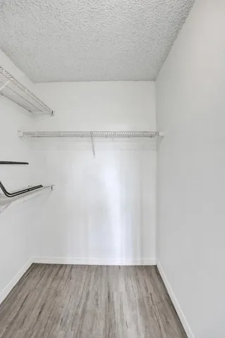 a view of an empty walk in closet