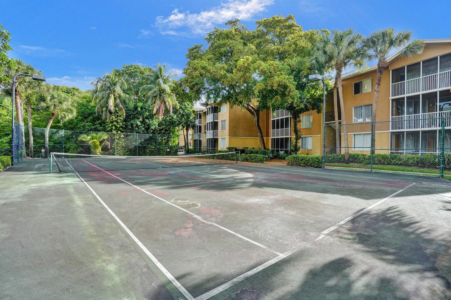 4015 West McNab Road, Unit D204 Pompano Beach, FL 33069 - Photo 42 of 46 a view of a building with a street
