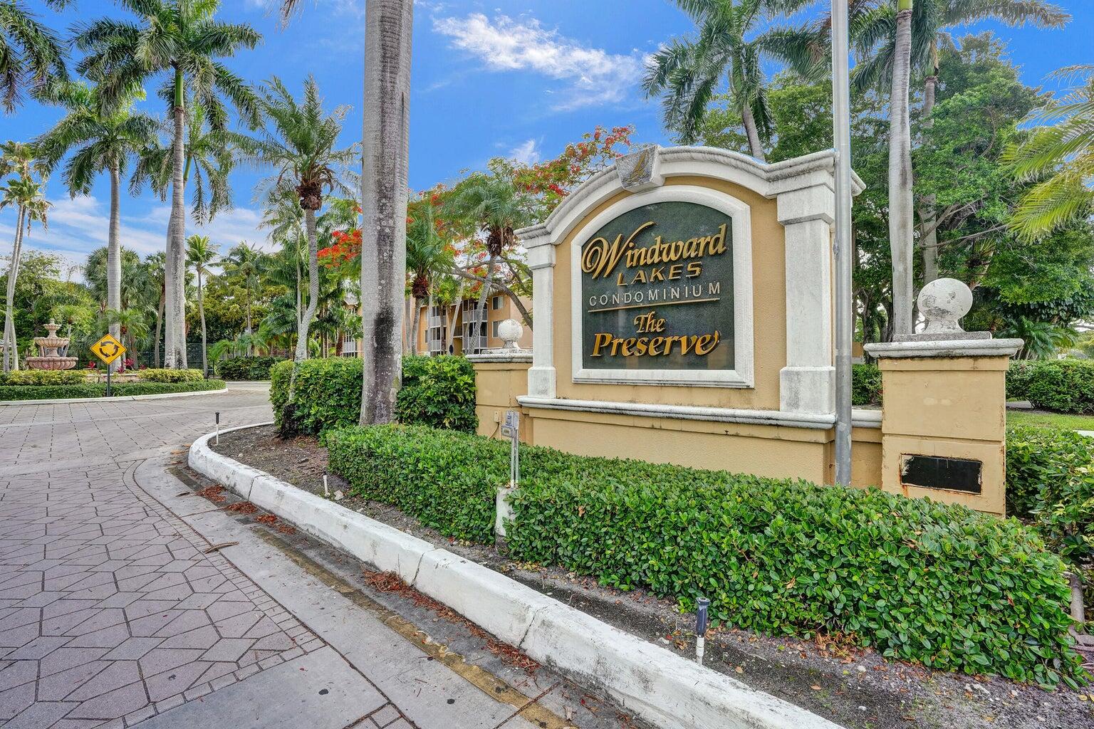 4015 West McNab Road, Unit D204 Pompano Beach, FL 33069 - Photo 43 of 46 a view of a house with a garden