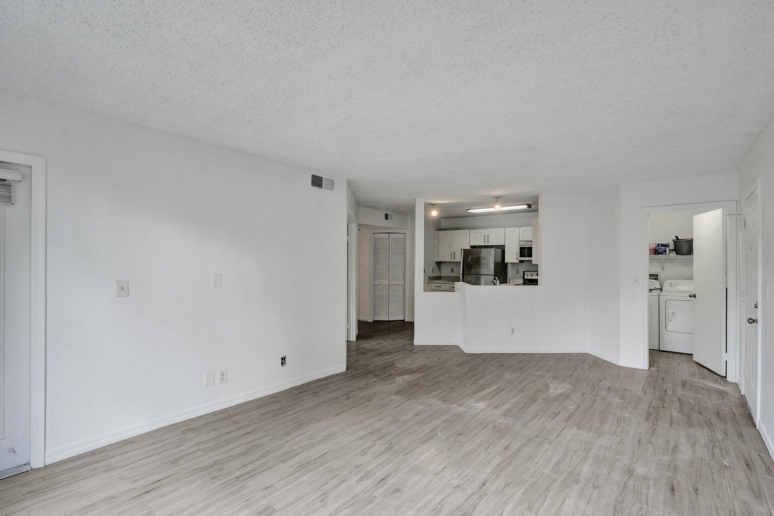 4015 West McNab Road, Unit D204 Pompano Beach, FL 33069 - Photo 7 of 46 a view of empty room with wooden floor