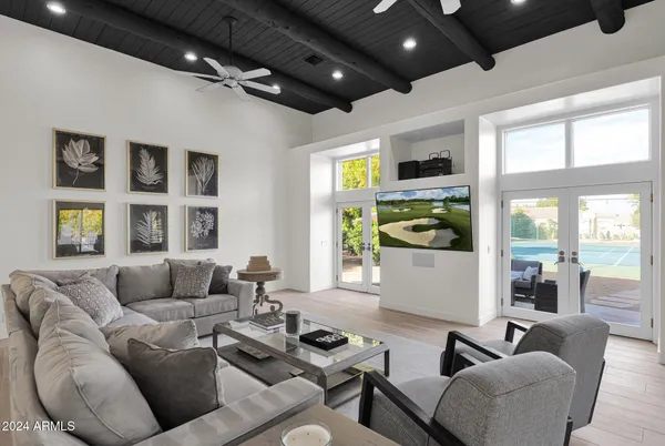 a living room with furniture and a large window