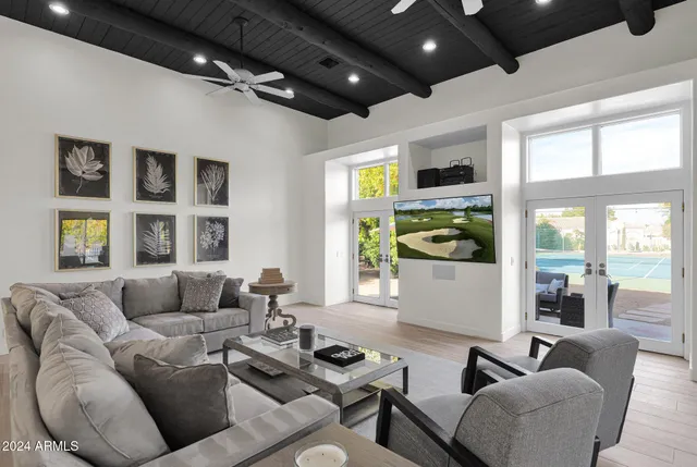 a living room with furniture and a large window