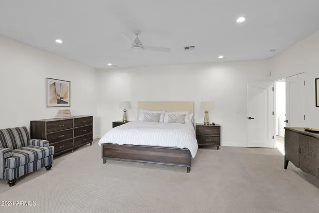 a bedroom with a bed and furniture