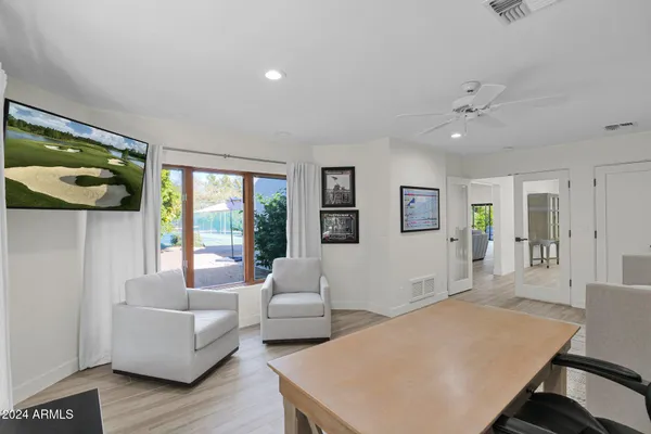 a living room with furniture and a large window