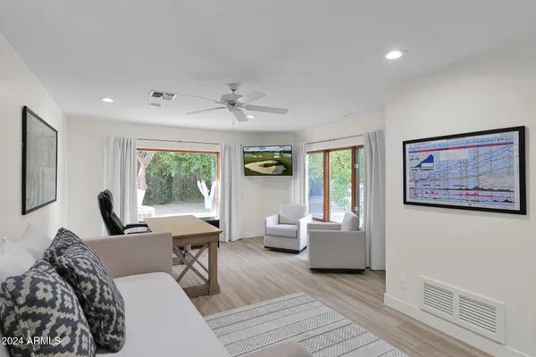 a living room with furniture and a large window