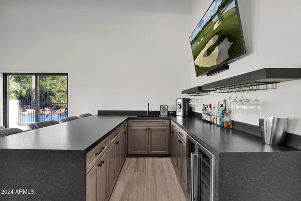 a kitchen with stainless steel appliances a sink stove and cabinets