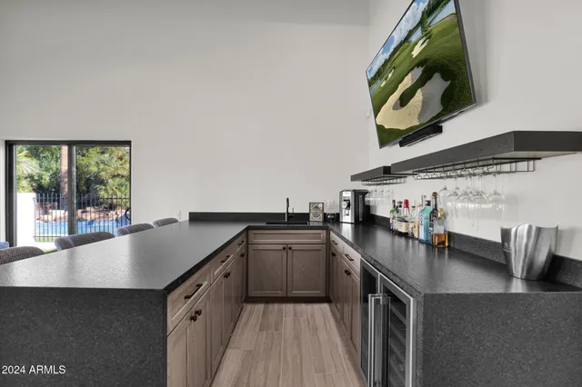 a kitchen with stainless steel appliances a sink stove and cabinets
