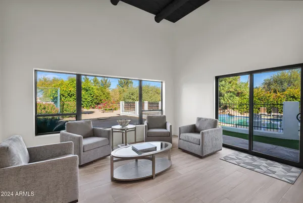 a living room with furniture and a large window