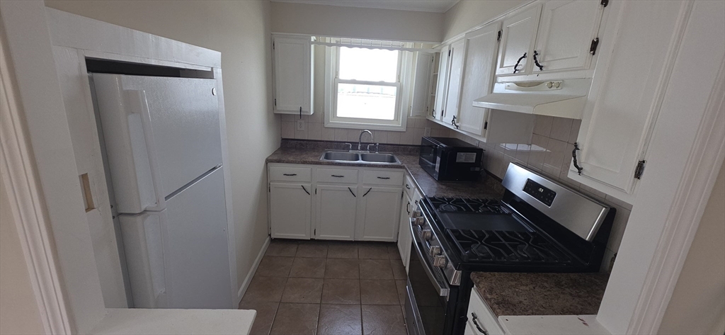105 6th Street, Unit 3 Fall River, MA 02721 - Photo 1 of 10 a kitchen with a refrigerator and a sink