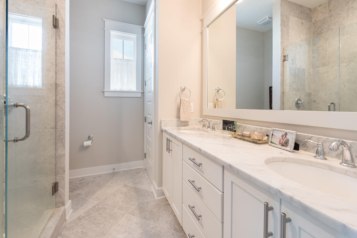 104 Milestone Dr Inlet Beach, Unit A Inlet Beach, FL 32461 - Photo 10 of 10 a bathroom with a granite countertop sink and a mirror