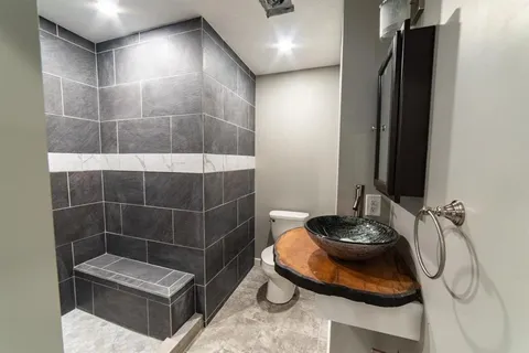 a bathroom with a sink and a shower