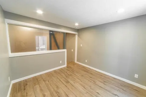 an aerial view of a house with garden space and street view