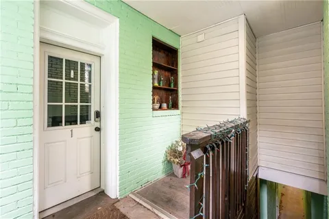 a view of a house with a door and a door