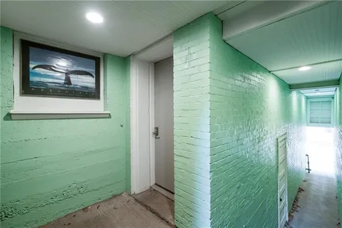 a kitchen with stainless steel appliances kitchen island granite countertop a refrigerator a sink a stove and oven