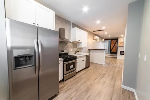 a view of a kitchen from the hallway