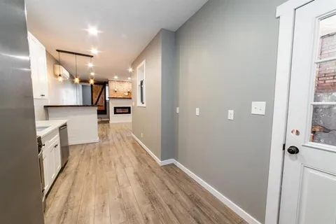 a black and white wall with rack on it