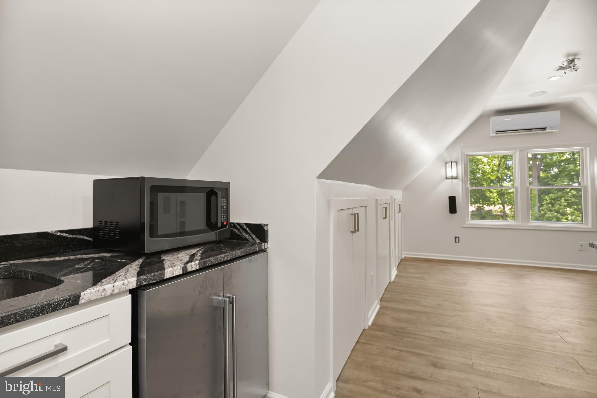 12261 Etchison Road Ellicott City, MD 21042 - Photo 46 of 69 Above garage addition with fridge & microwave