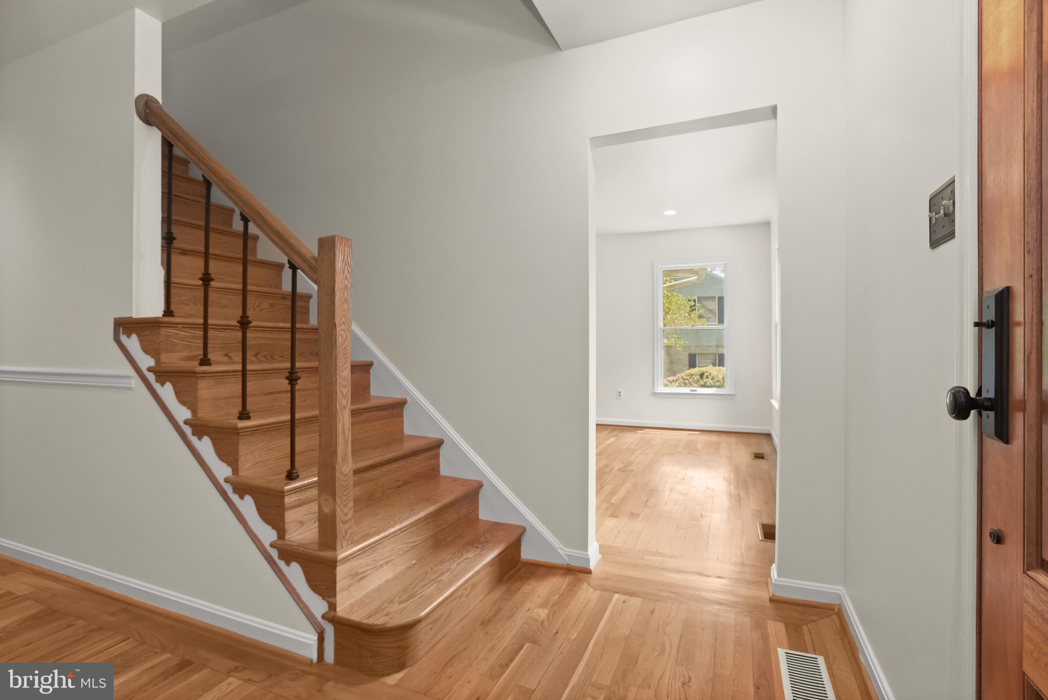 12261 Etchison Road Ellicott City, MD 21042 - Photo 9 of 69 Foyer highlights oak staircase & hardwood flooring