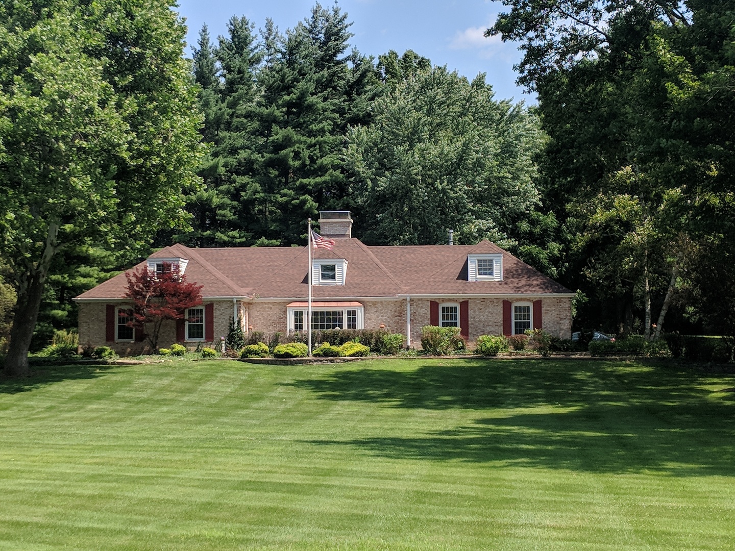1750 Banbury Road Inverness, IL 60067 - Photo 1 of 31 a front view of a house with a garden