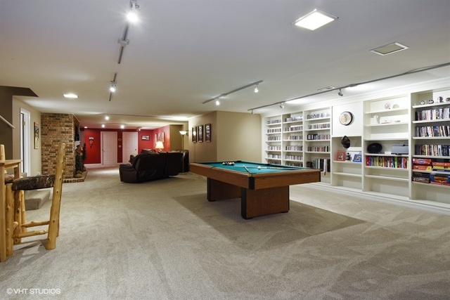 1750 Banbury Road Inverness, IL 60067 - Photo 20 of 31 a large room with gym equipment and a window