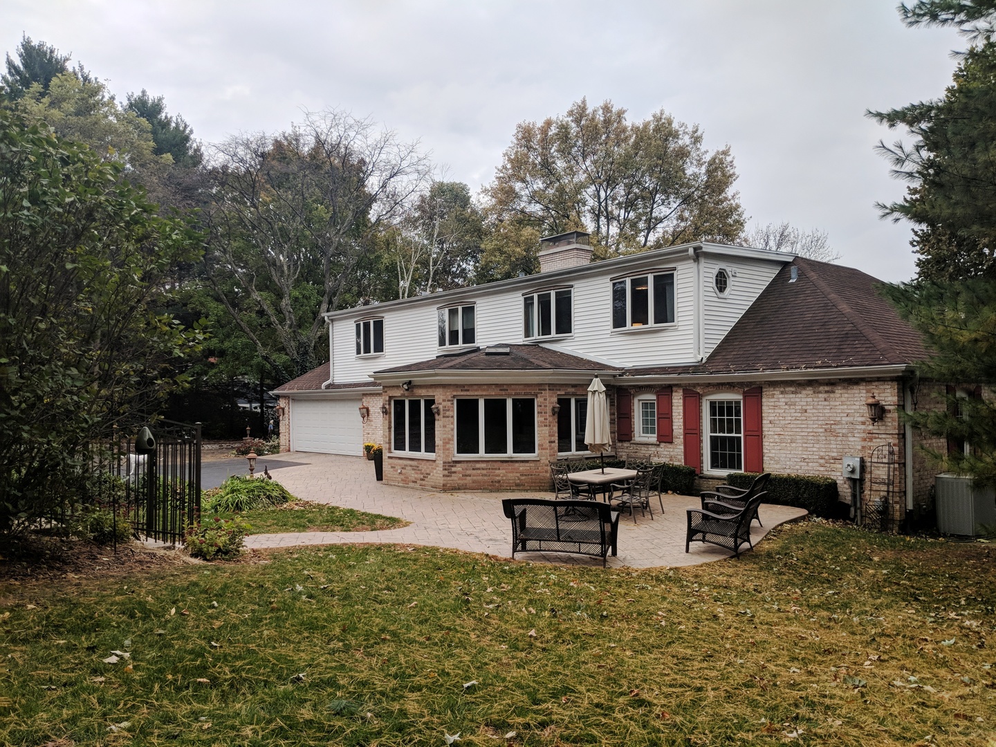 1750 Banbury Road Inverness, IL 60067 - Photo 24 of 31 a white house that has tree in front of it