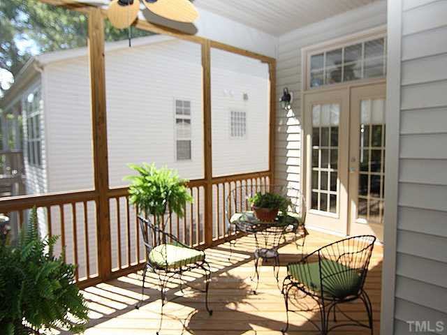 6153 Blakeman Lane Raleigh, NC 27617 - Photo 11 of 12 Large screened porch with ceiling fans open to both master bedroom and breakfast room. you and your pets will love the view of the backyard and nature from the porch. Screened Porch