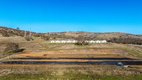a view of swimming pool with a yard and mountain in the back