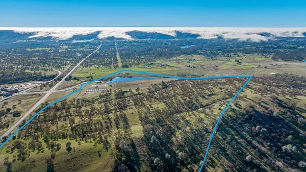 a swimming pool with outdoor seating and yard